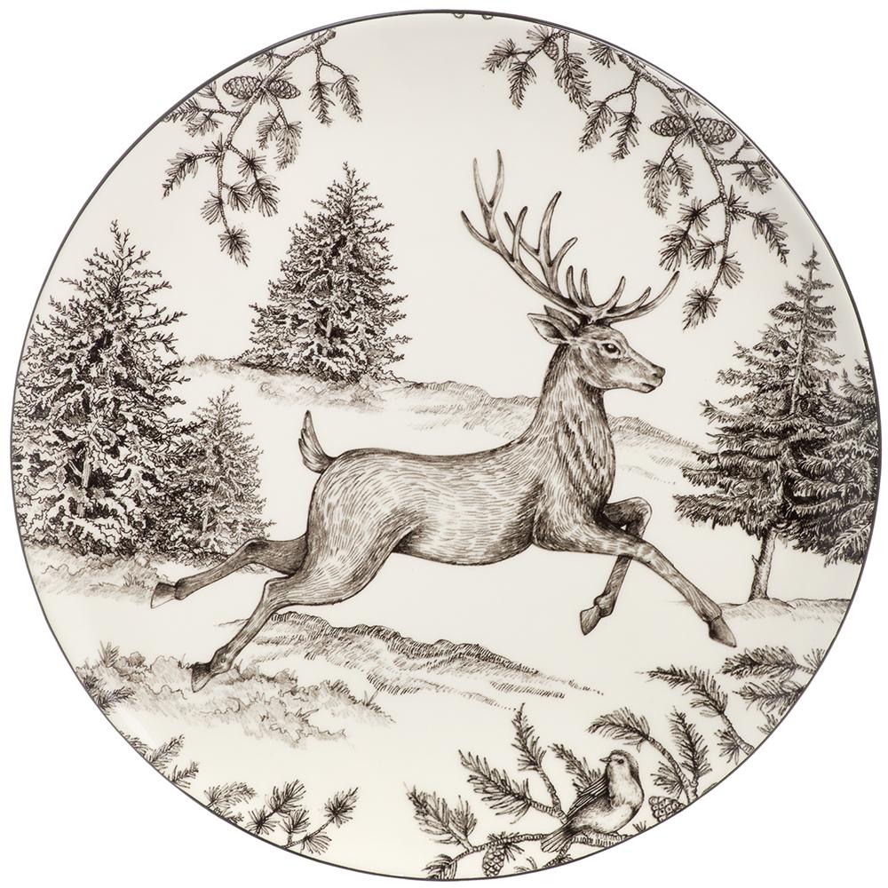Decorative plate with a deer and forest design on a white background