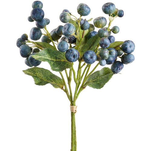 Artificial blue crabapple branch with green leaves on a white background