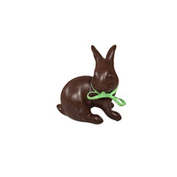 Chocolate brown bunny-shaped figure with a green ribbon