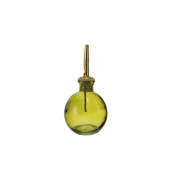 Green glass bottle with brass cap on a white background