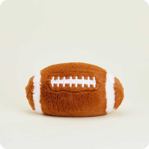 Plush football toy on a white background