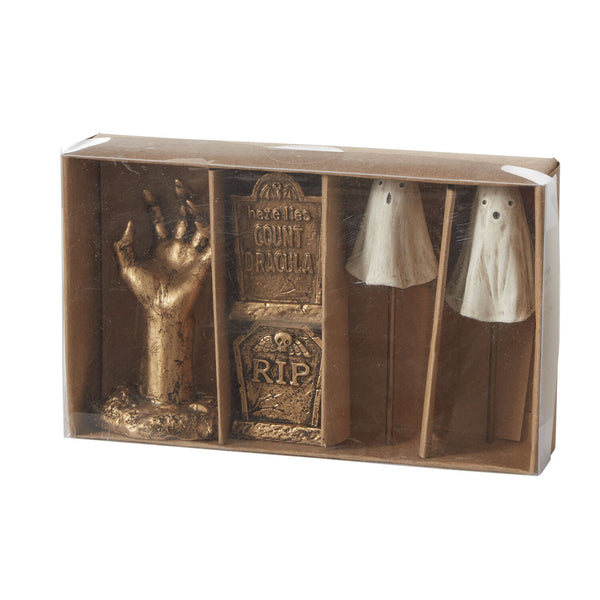 Set of Halloween-themed decorations including a hand, tombstone, and ghost figures in a box.