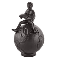 Brown Cast Iron Boy Reading on Globe Sculpture | Danya B.