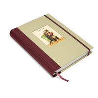 Beige notebook with a cat illustration on the cover against a white background