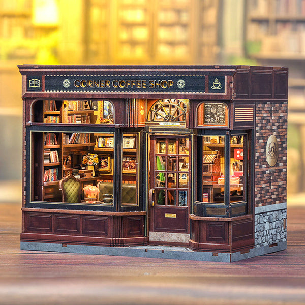 Model of a corner coffee shop with detailed interior and exterior.