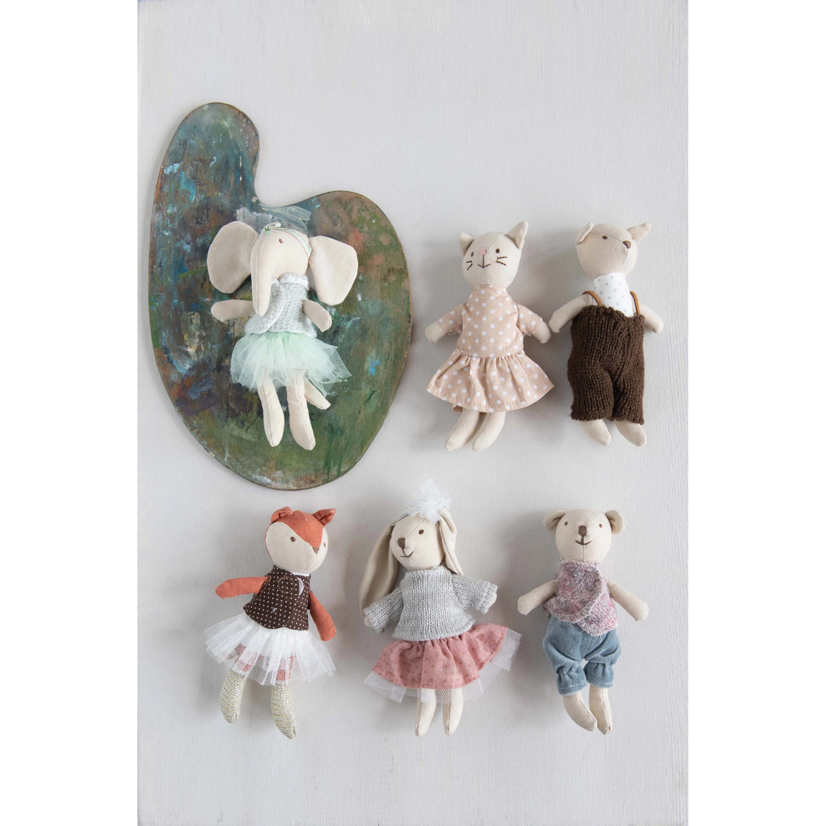 Set of small stuffed animals including an elephant, cat, dog, fox, rabbit, and bear on a white background.