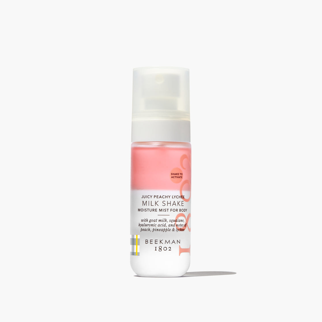 Bottle of Beekman 1802 Milk Shake Moisture Mist for Body on a white background