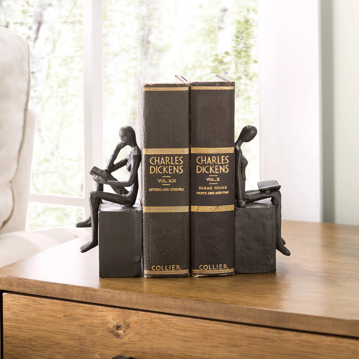 Man and Woman Reading on a Block Cast Iron Bookend Set | Danya B.