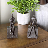 Man and Woman Reading on a Block Cast Iron Bookend Set | Danya B.