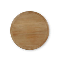 A top down view of a circular accent table on a white background.