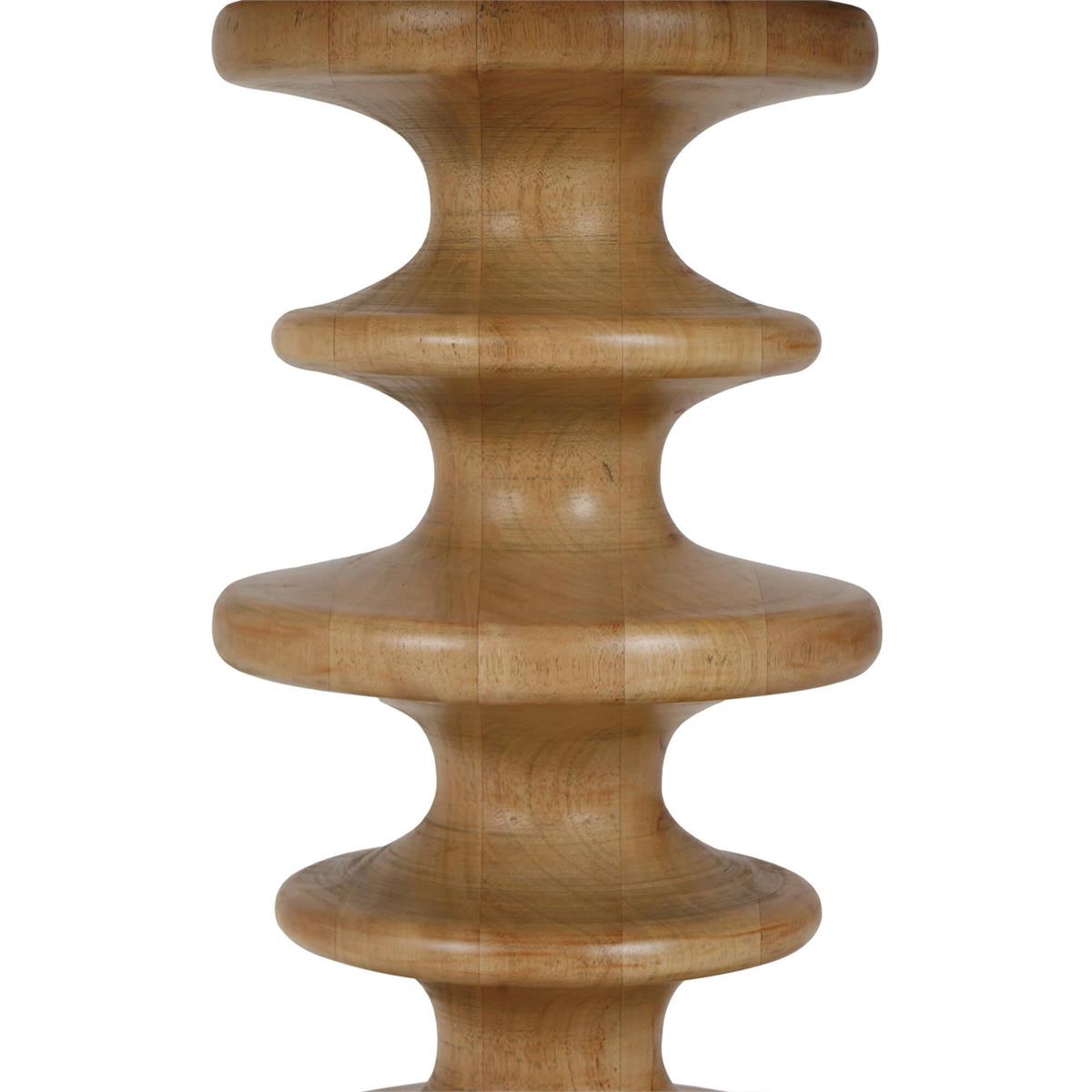 A close up of the main column of a carved accent table on a white background.