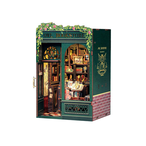 Model of a bookstore with decorative elements on a white background