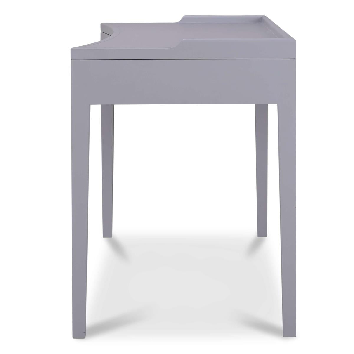 A side view of a gray rectangular desk with three drawers on a white background.