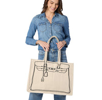 Woman holding a beige tote bag with a black outline design on a white background