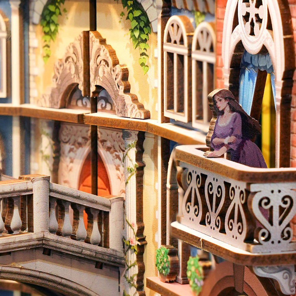 Miniature model of a woman on a balcony with architectural details