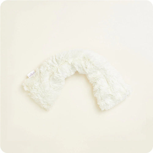 White fluffy neck wrap on a light beige background