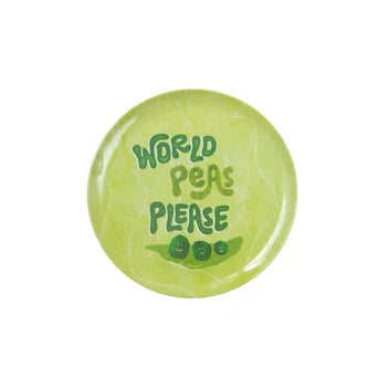 A round light green melamine plate with the text 'WORLD PEAS PLEASE' in dark green lettering, accompanied by a small illustration of green peas on a leaf, shown on a plain white background.